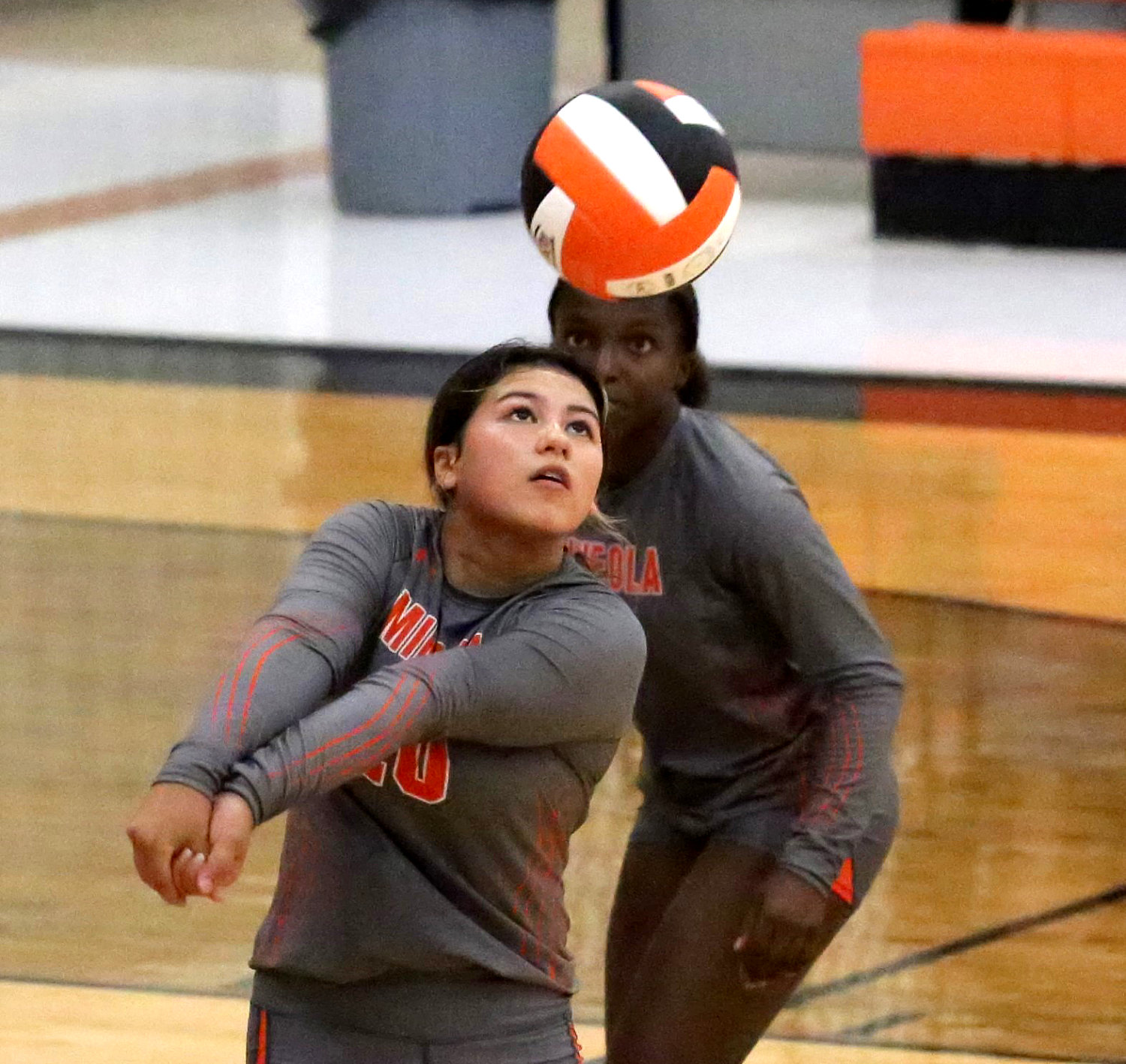 Lady Jacket Kloey Garcia, sharing the back line with Shylah Kratzmeyer, turns to dig a strike in action against Grand Saline. See story Page 10A.